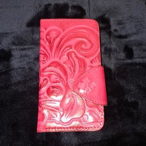 Pink leather folio wallet iPhone case.